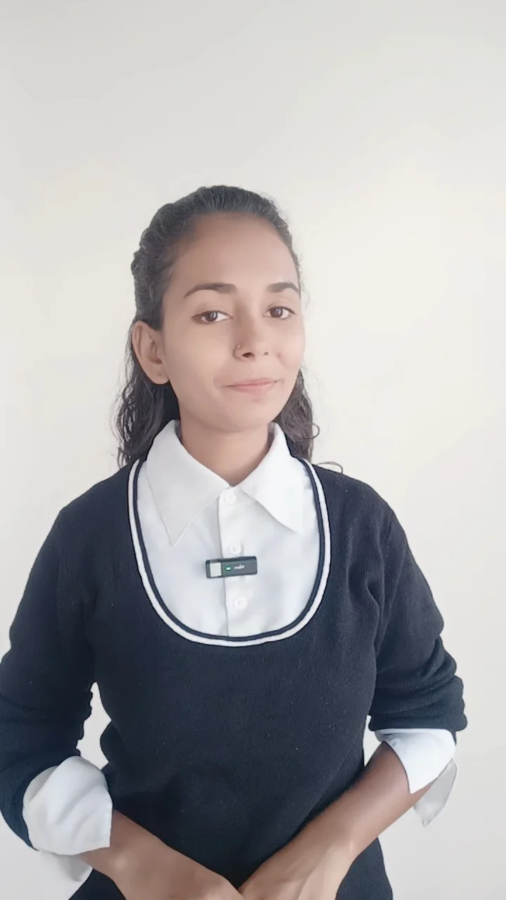 Young woman in black sweater and white collared shirt on white background